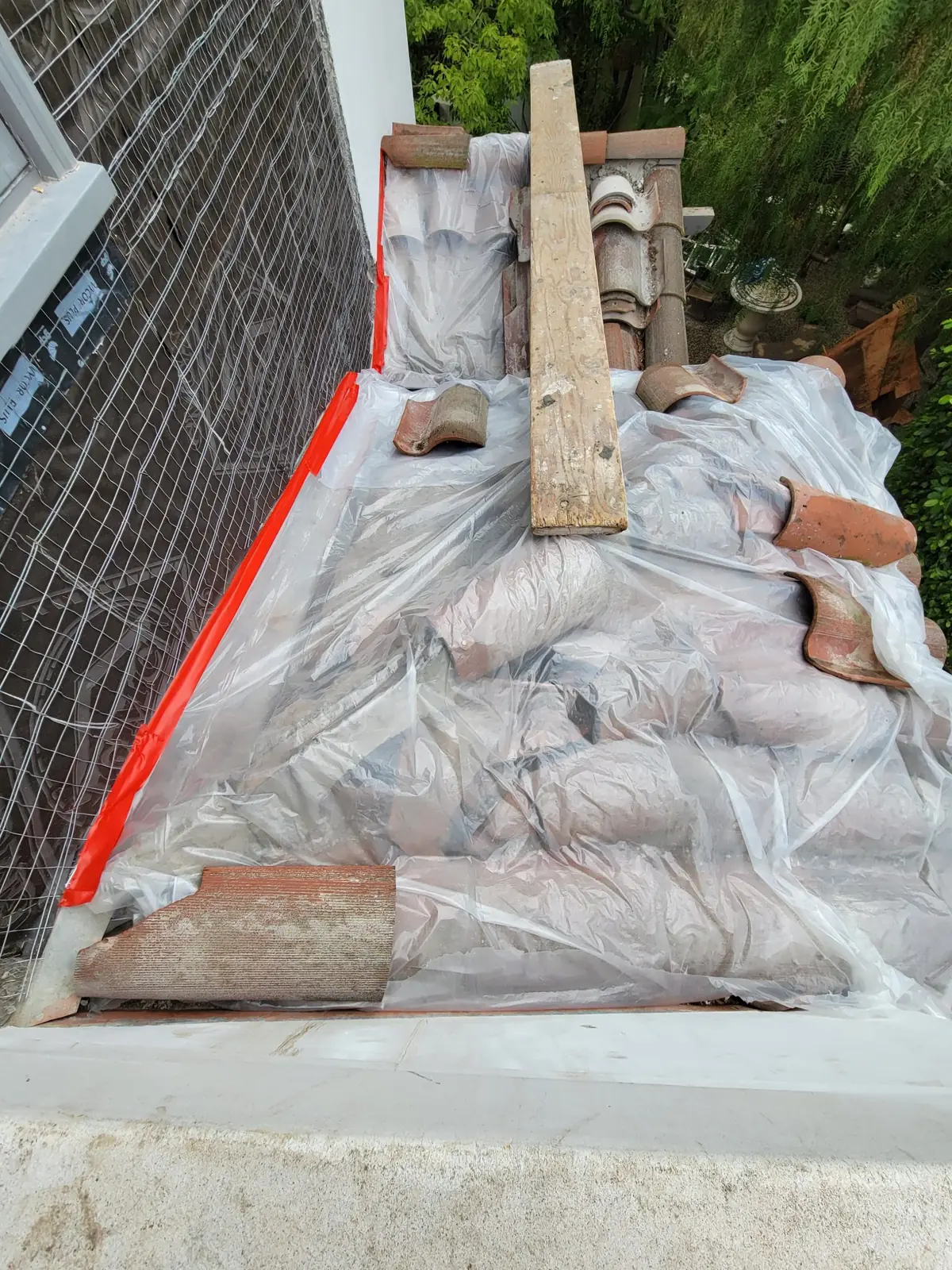 Brentwood window water intrusion repair with protected roof tile and exterior work access