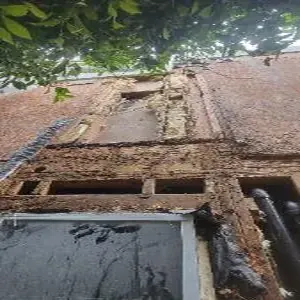 Exterior wall opened to framing during Hermosa Beach water damage reconstruction