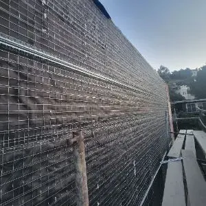 Opened exterior wall section during Mount Washington hillside water damage reconstruction
