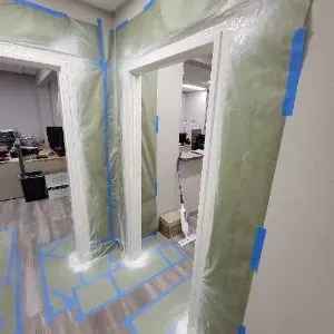 Protected commercial doorway during Vernon water damage mitigation
